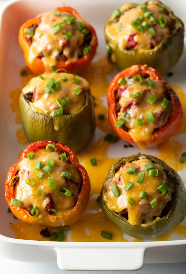 top view baked stuffed peppers with cheese and scallions
