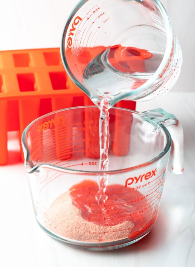 Warm water being poured over gelatin.