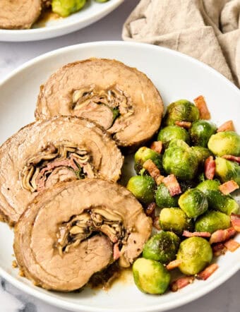 Stuffed Flank Steak Recipe with Prosciutto and Mushrooms on plate
