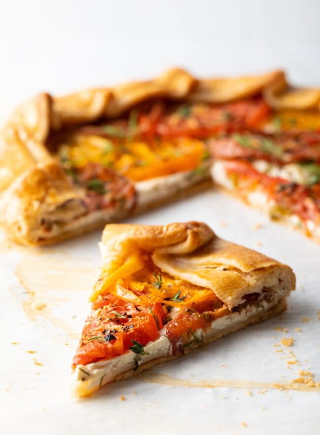 Close view piece of baked tomato savory pie.