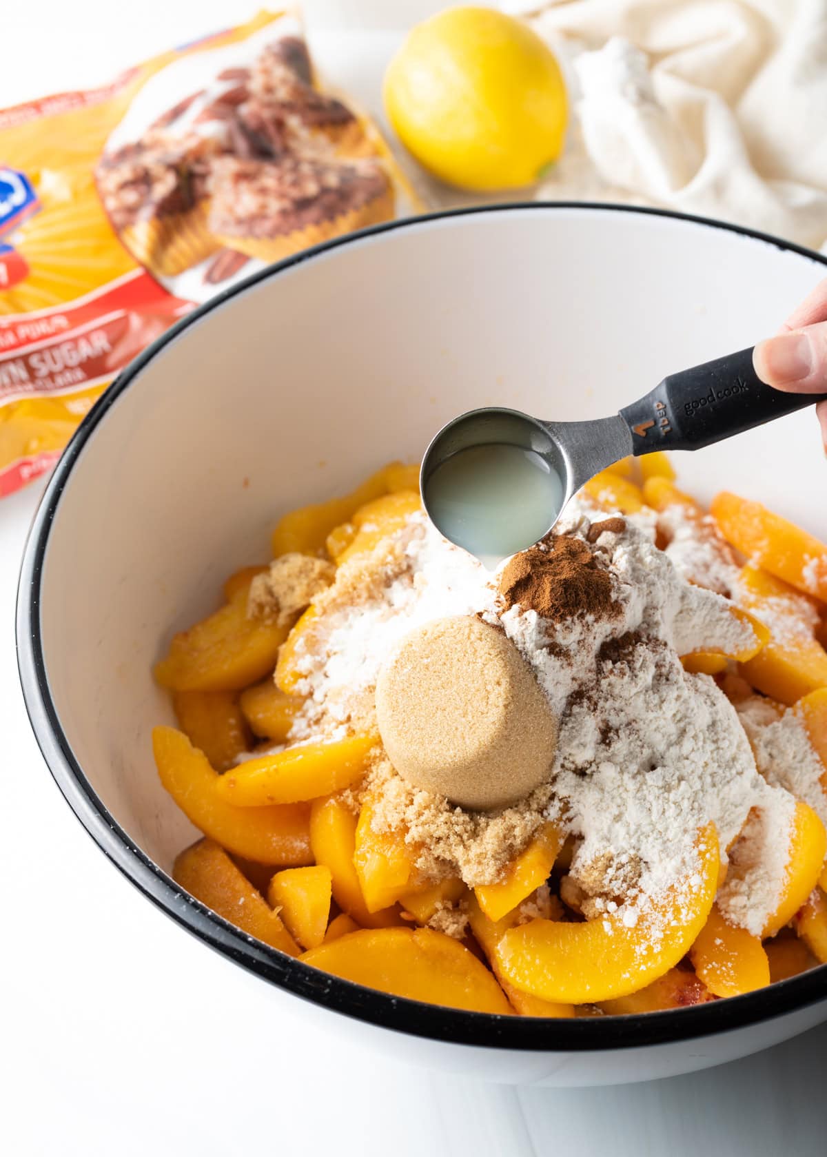 Bowl filled up with peach filling ingredients.