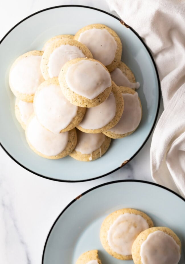 Plates stacked with earl grey tea cookies with lemon glaze.