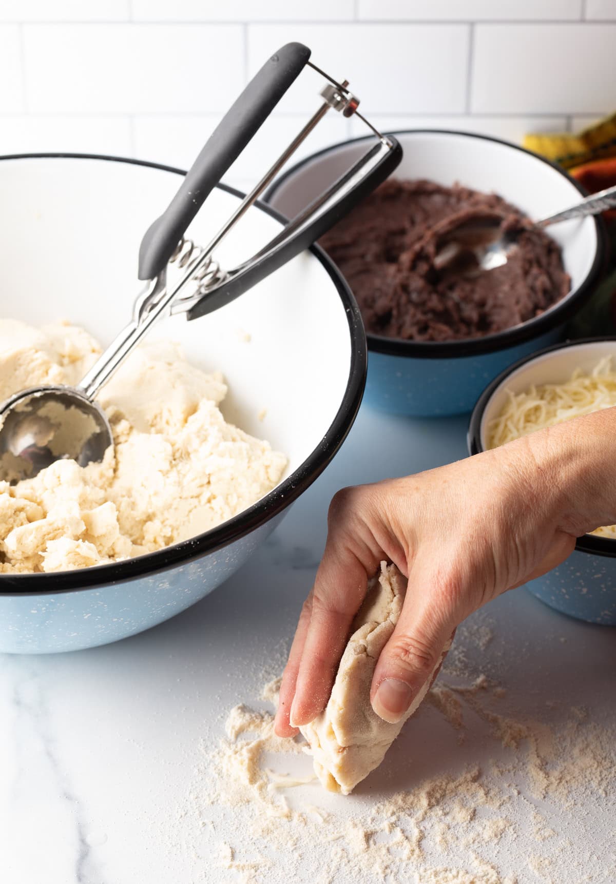 Hand shaping dough.