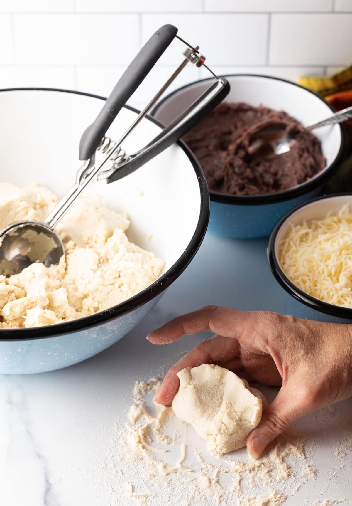Hand shaping dough.