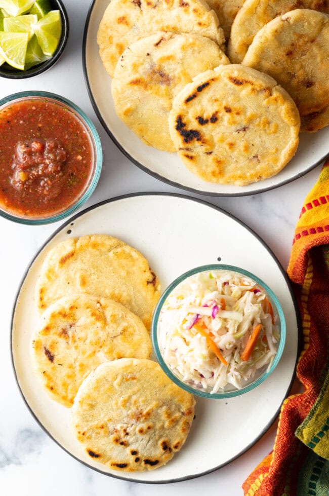How to Make Pupusas - Top down pupusas on a plate with coleslaw.