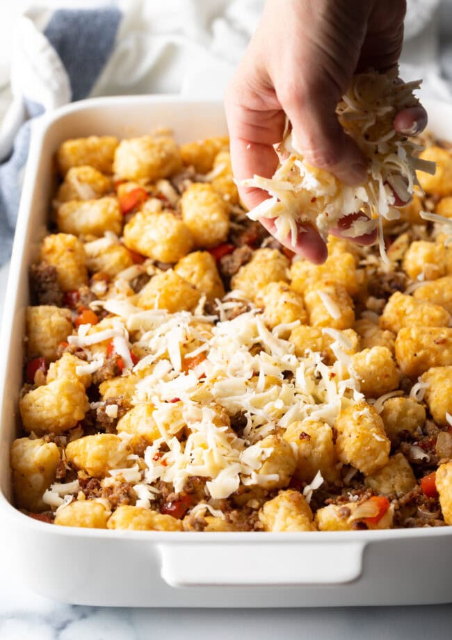 sprinkle cheese into baking pan
