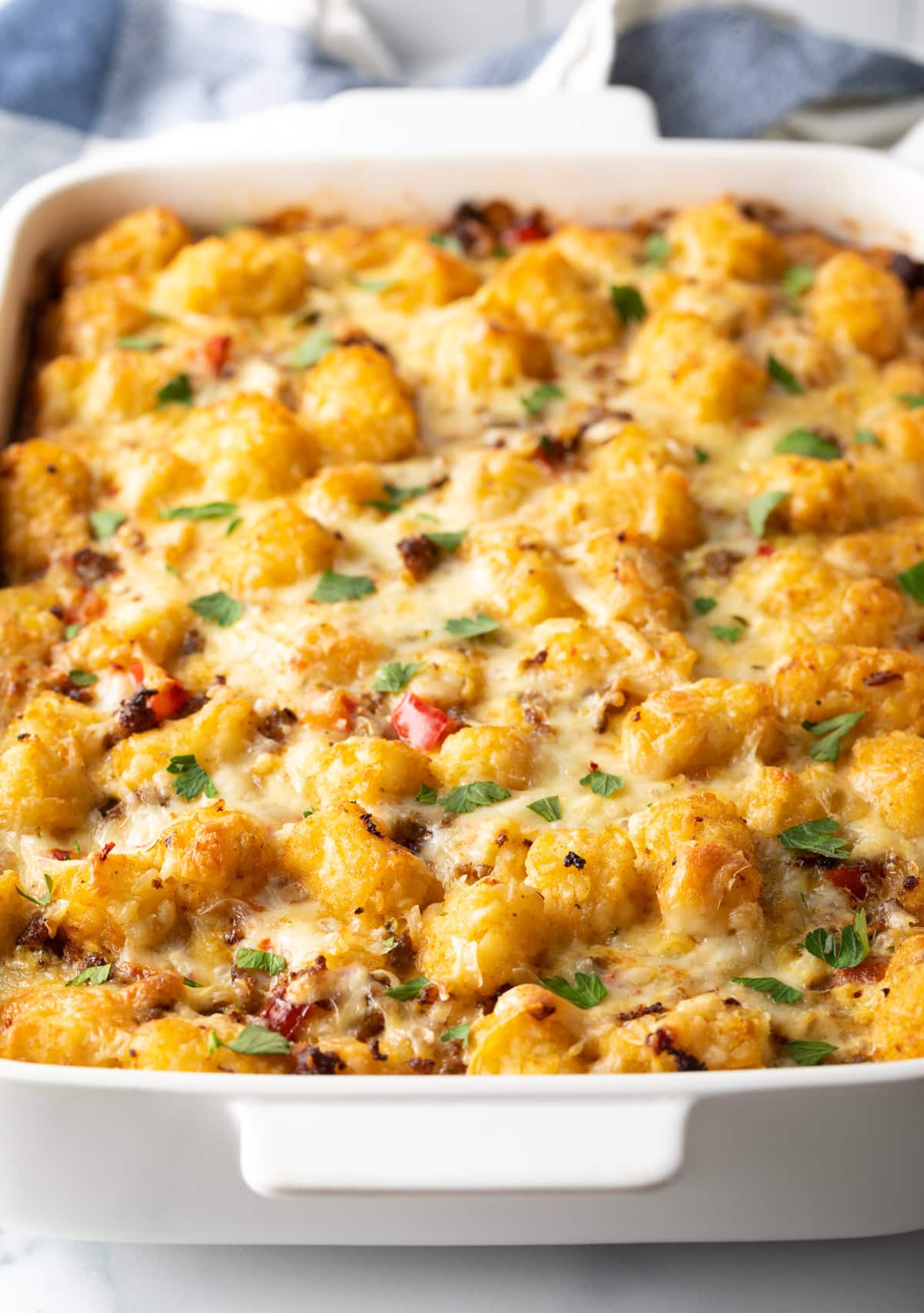 Spicy breakfast casserole with tater tots hot from the oven.