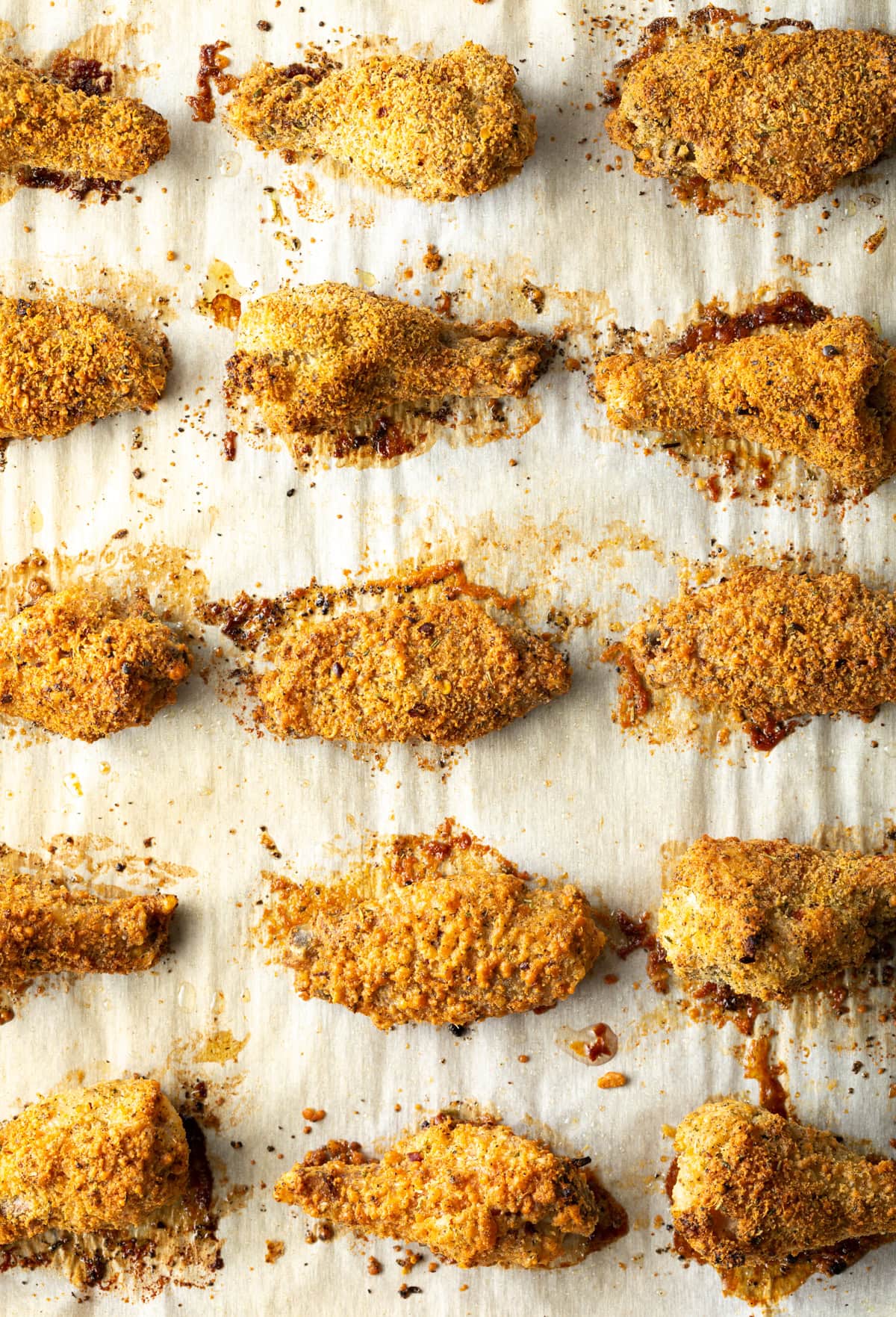 Baked garlic parmesan wings on baking sheet.