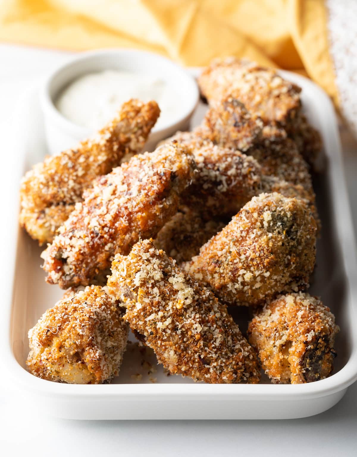 Serving platter with crispy baked garlic parmesan wings.