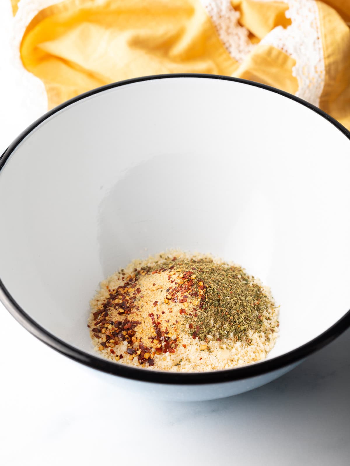 White mixing bowl with spices.