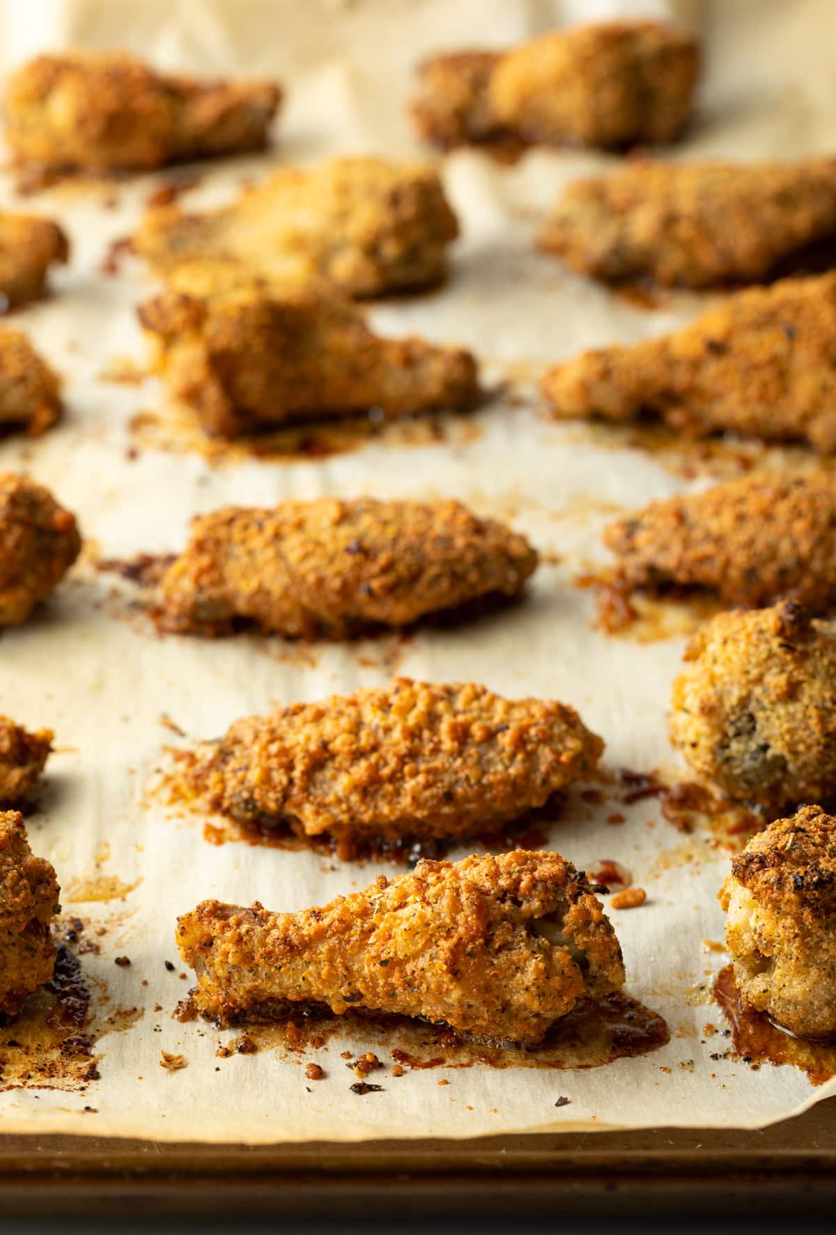 Crispy baked wings on a baking sheet.