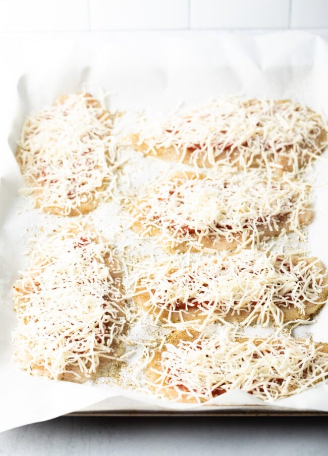 Shredded cheese added to thin cutlets.