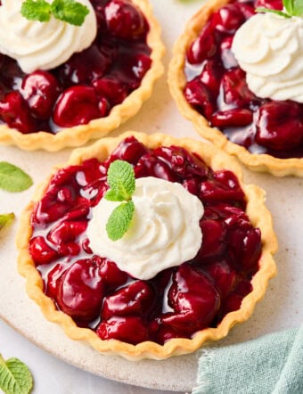 This recipe for Cherry Tarts is easy to follow and results in a delicious dessert that your family will love. Best of all, it only takes about 30 minutes from start to finish!