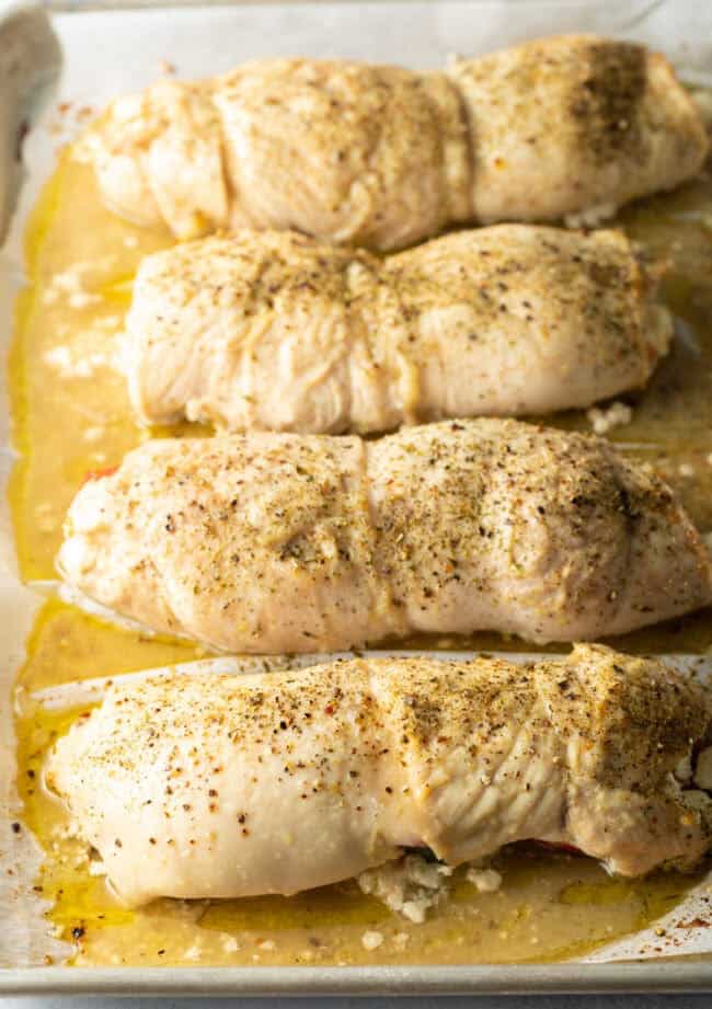 Baked roulade, cooked and still wrapped on a baking sheet.
