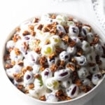 Grape salad in a white bowl.