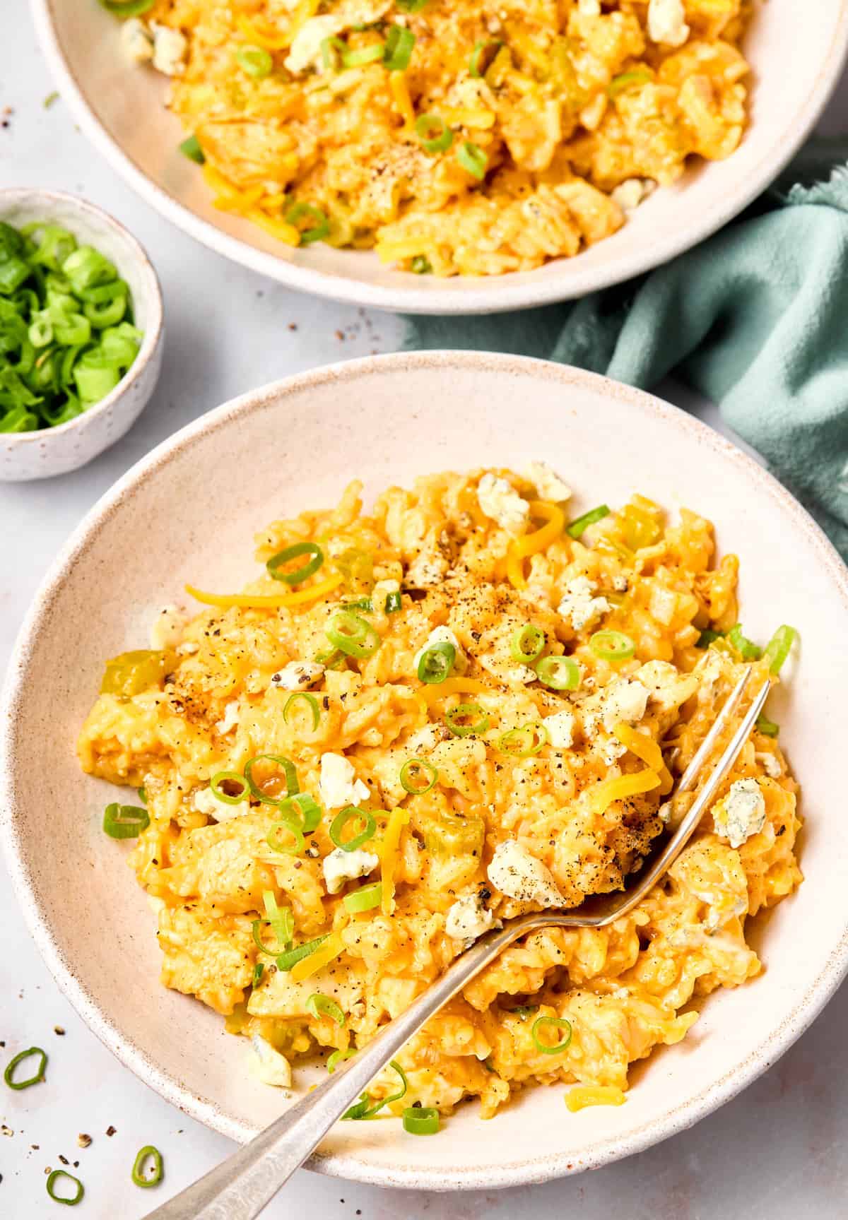 Buffalo Chicken Casserole Recipe with rice and cheese in bowls