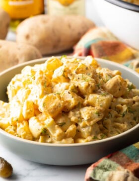 Bowl of the finished potato salad with paprika.