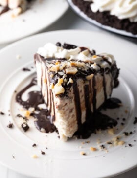 Slice of chocolate Duke's Hula Pie on a white plate.