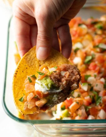 Close view of tortilla with scoop of the dip.