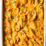 Top down view baked stuffed shells seafood pasta.