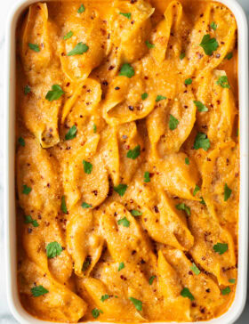 Top down view baked stuffed shells seafood pasta.