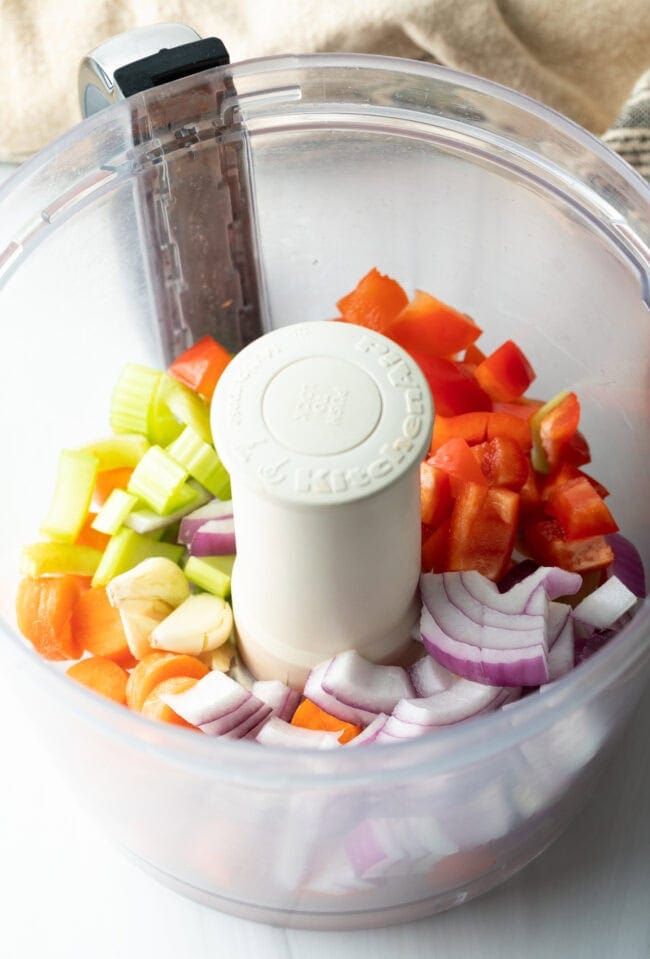 Fresh chopped veggies in a food processor.