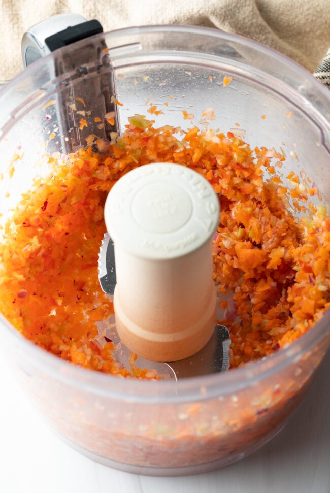 Chopped veggies in a food processor.