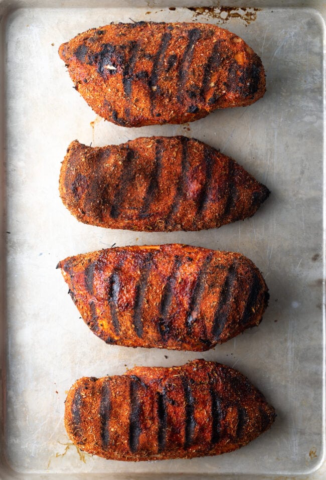 Grilled Blackened Chicken - Four large grilled chicken breasts seasoned with blackening spice.