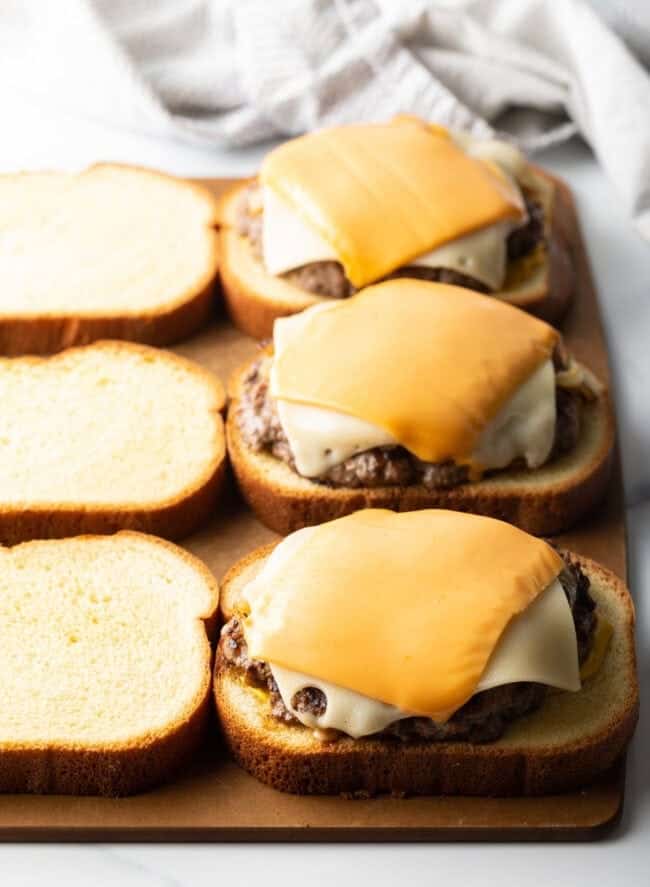 Texas toast topped with burger patties.