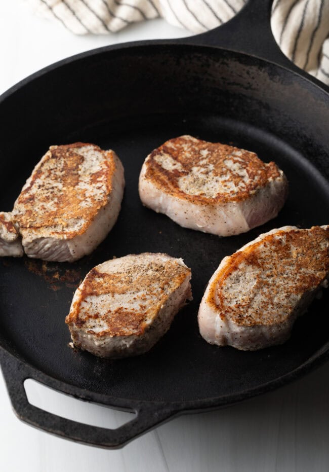 4 chops seared brown in a cast iron skillet.