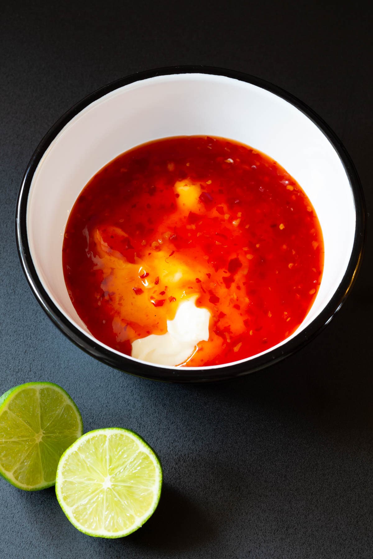Ingredients for bang bang sauce in bowl. 