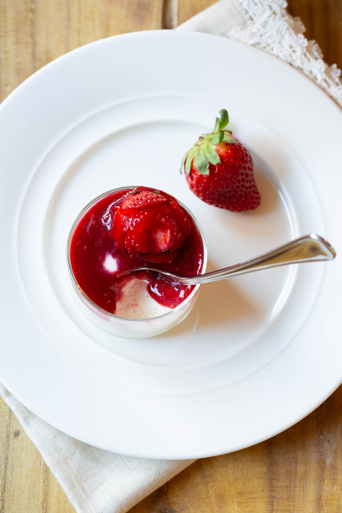 Top down view of plated Swedish cream with a spoon in it.