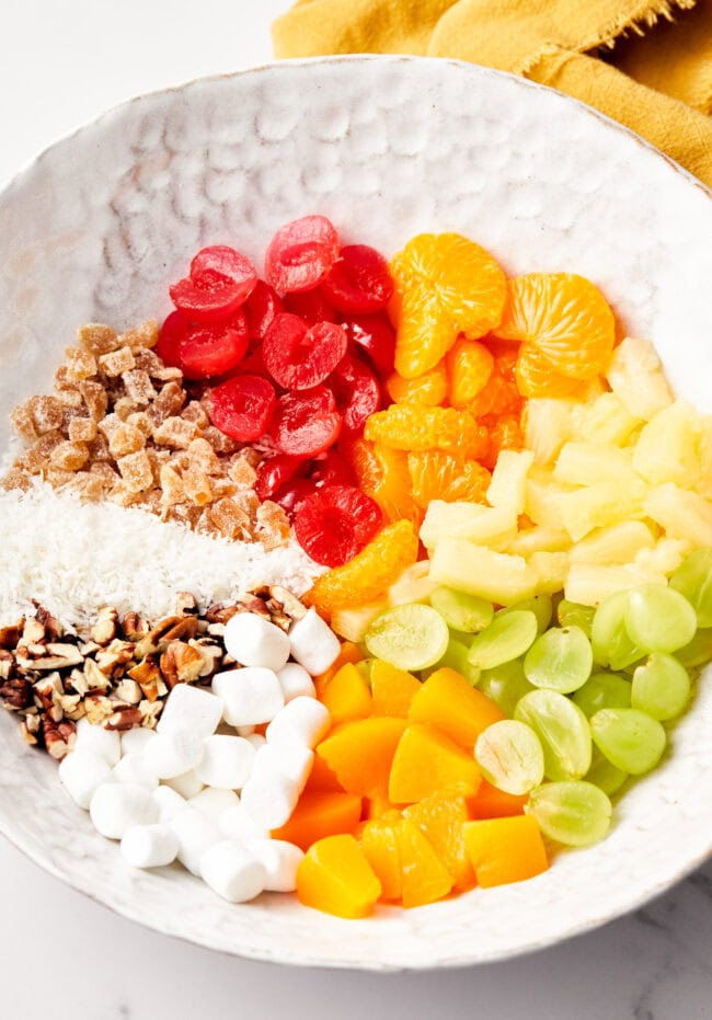 Closeup view of bowl with measured and chopped ingredients for Ambrosia Salad Recipe 