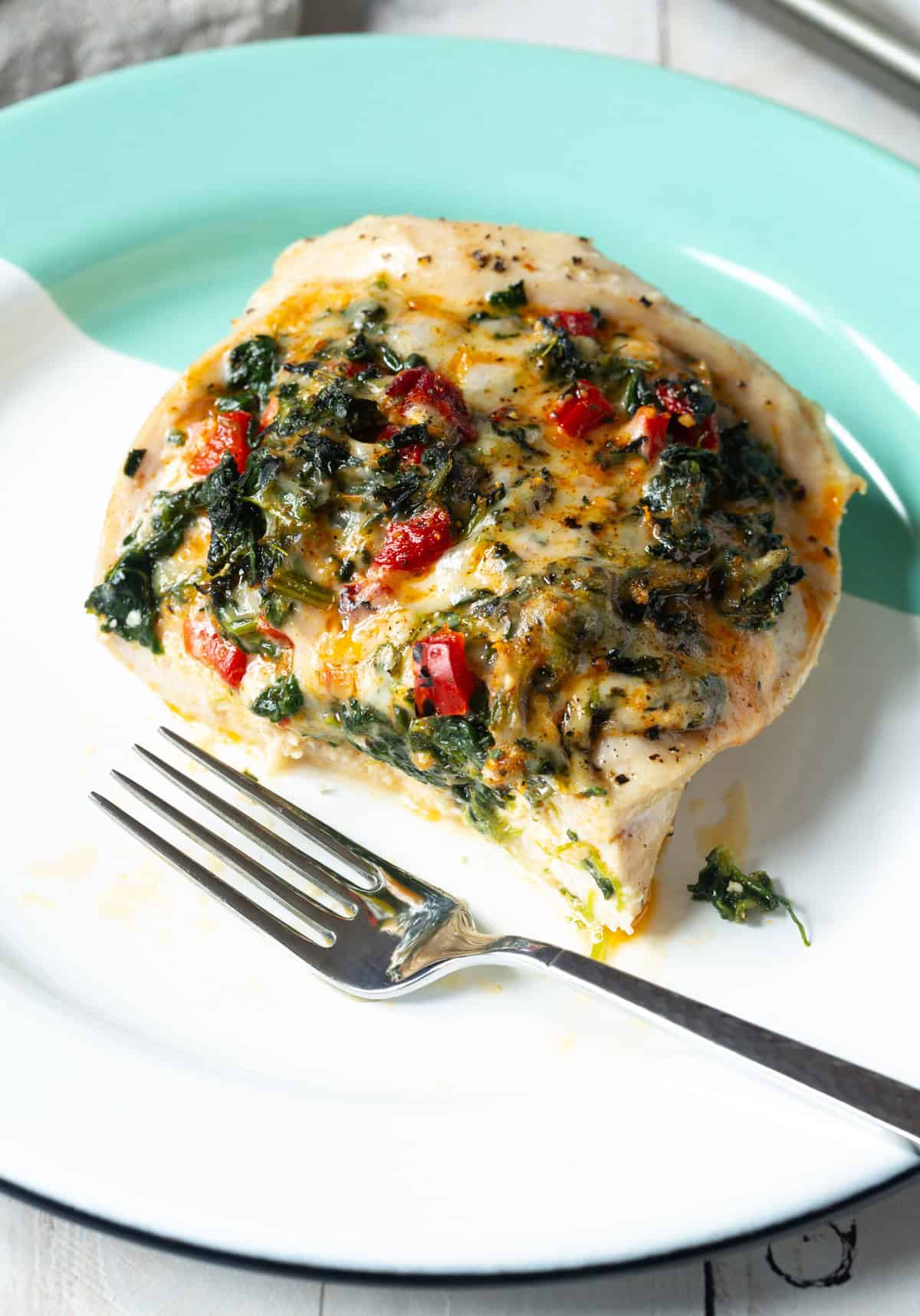 Cheesy Stuffed Chicken Breasts cut with fork so filling is exposed