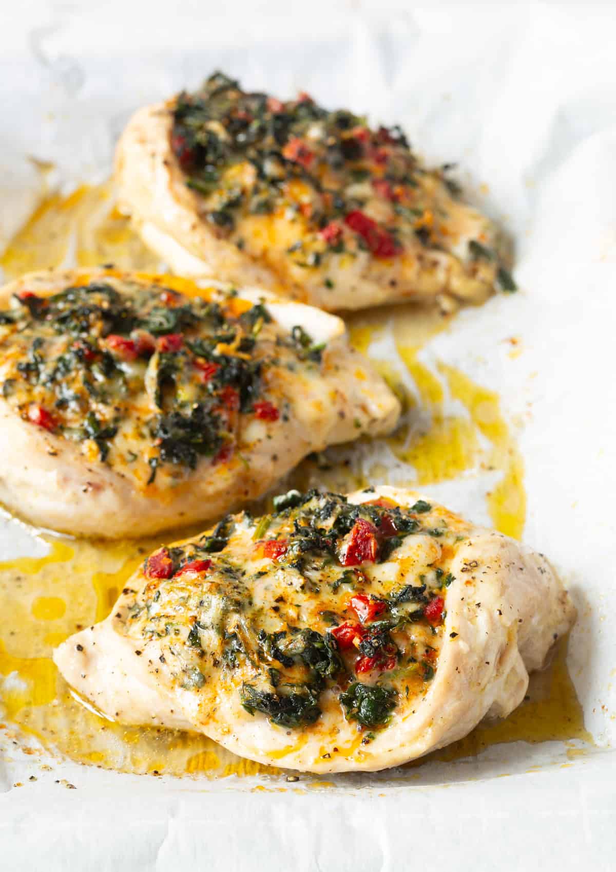 Spinach Stuffed Chicken Breast Recipe on baking sheet after baking