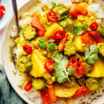 Perfect Island Slow Cooker Potato Curry Recipe over rice in bowl