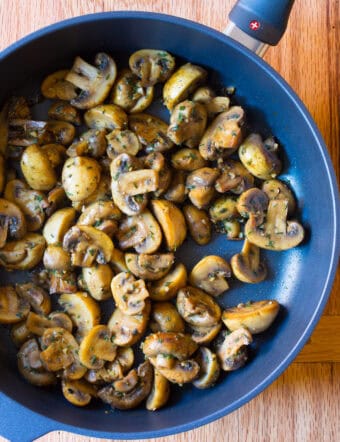 HEAVENLY Sautéed Mushroom Recipe in skillet - for topping steaks or risotto