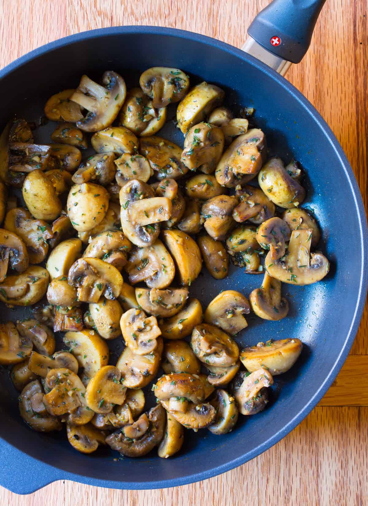 HEAVENLY Sautéed Mushroom Recipe in skillet - for topping steaks or risotto