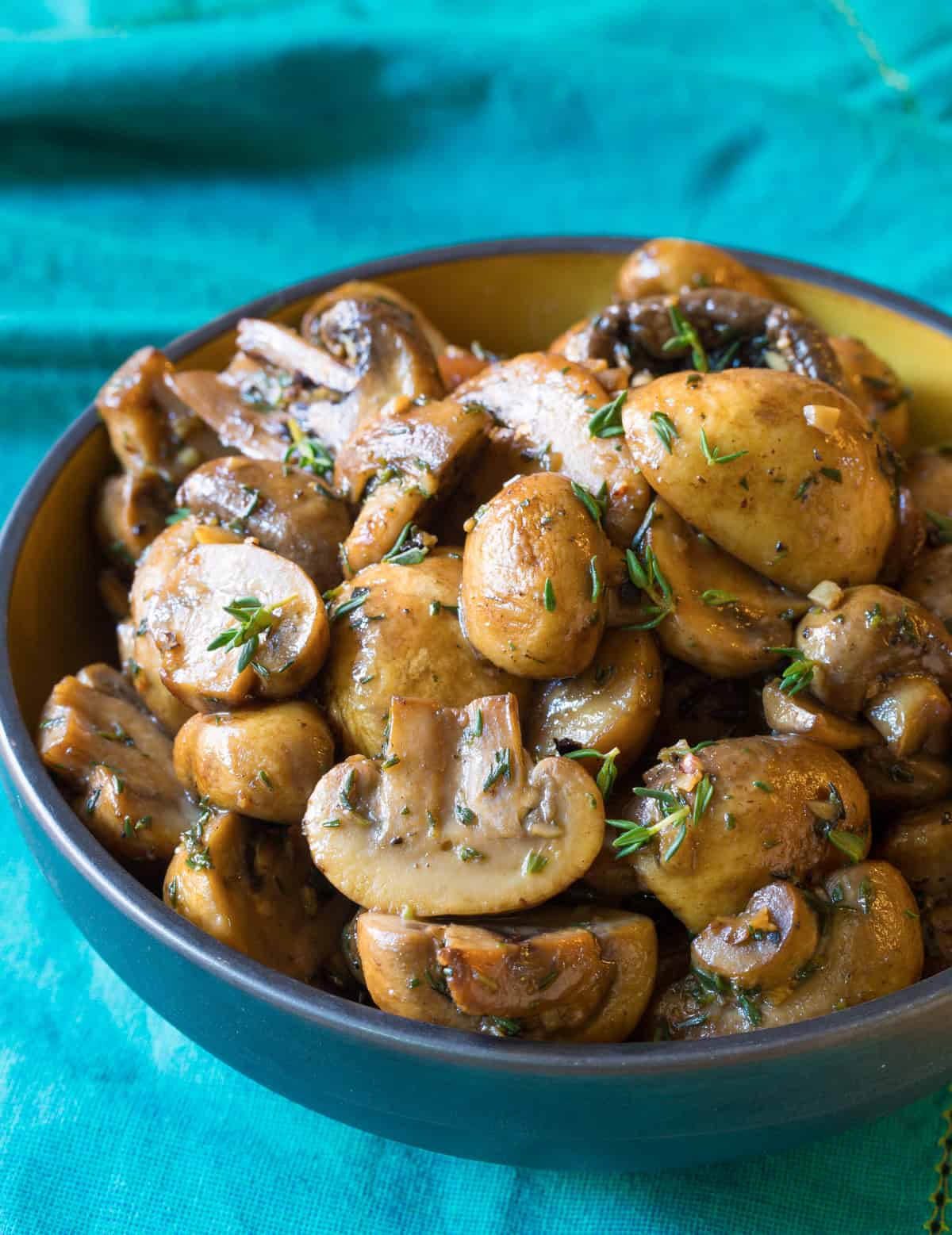 Sauteed Mushrooms in bowl with blue napkin