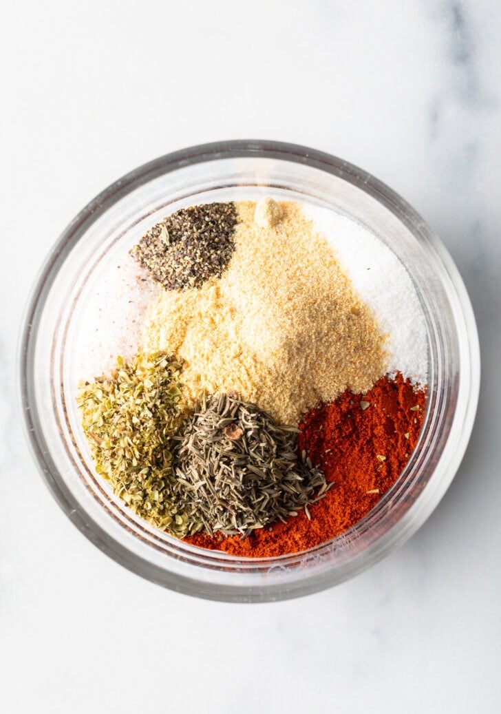 All of the blackening seasoning in a glass dish.