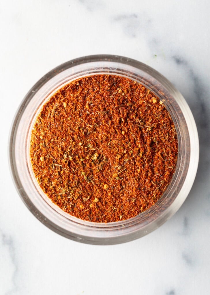 Blackening seasoning in a glass circular dish.