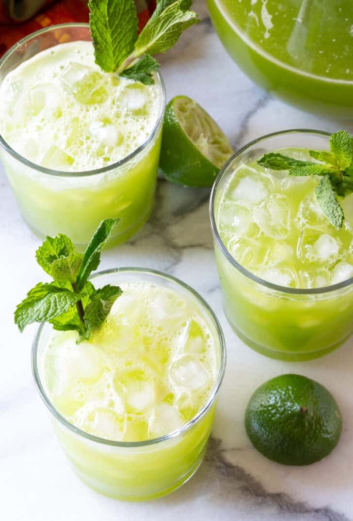 easy agua fresca in three clear glasses with mint garnish