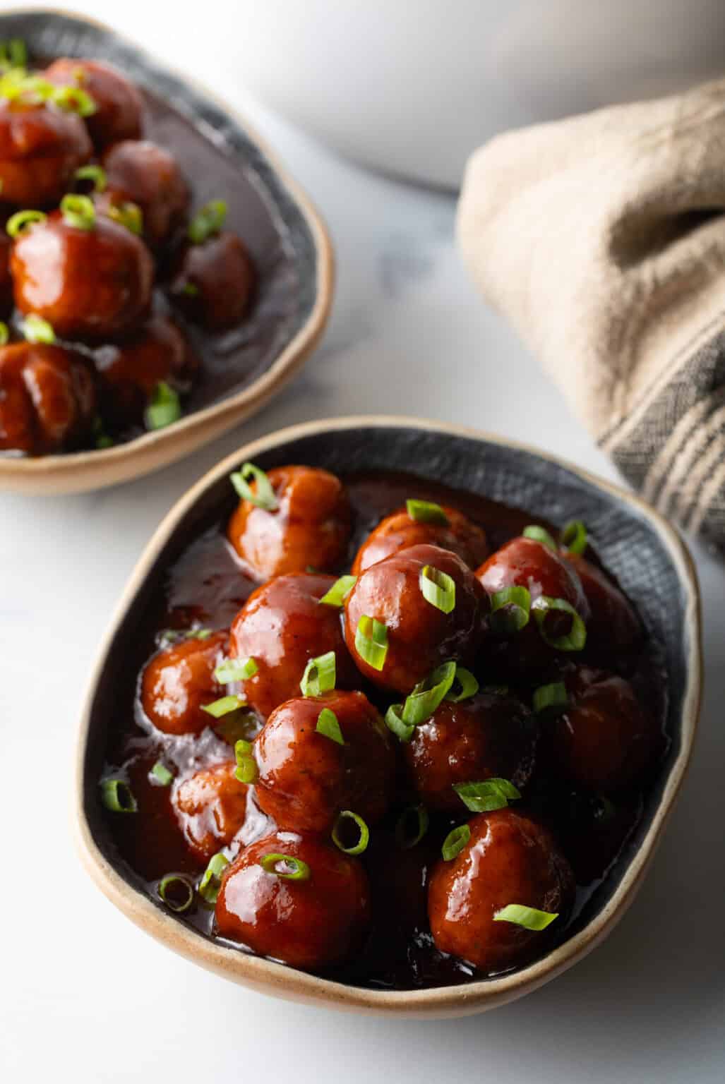 Crockpot BBQ Meatballs with a rich, dark barbecue sauce coating