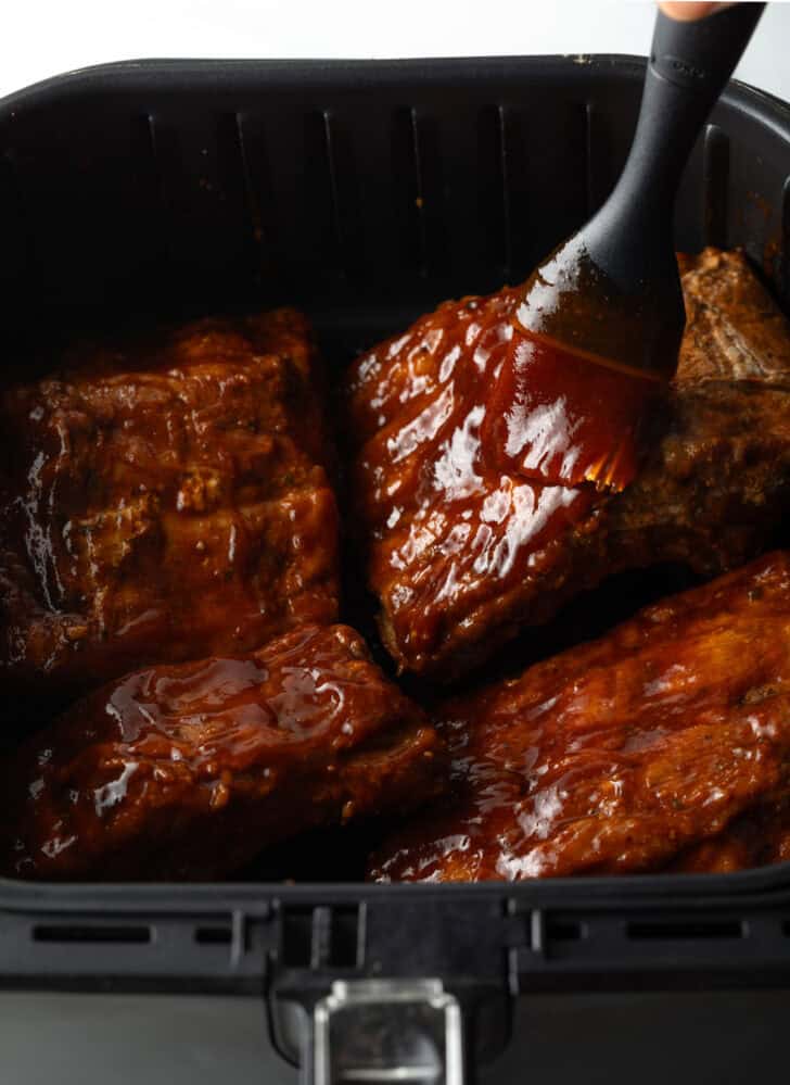 Basting ribs in the air fryer with barbecue sauce