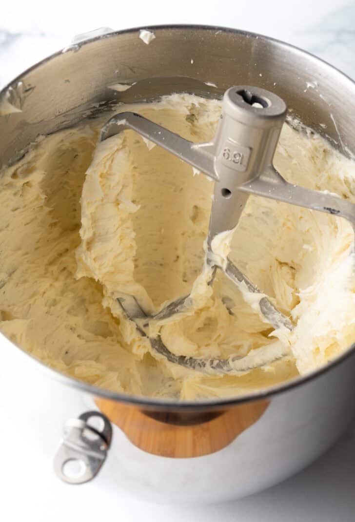 Cornbread cookie dough in a metal standing mixer bowl.