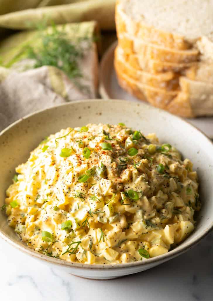 White bowl of deviled egg salad.