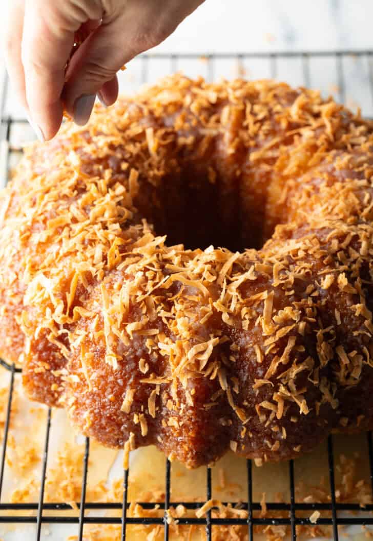 Rum soaked bundt cake covered in toasted coconut.