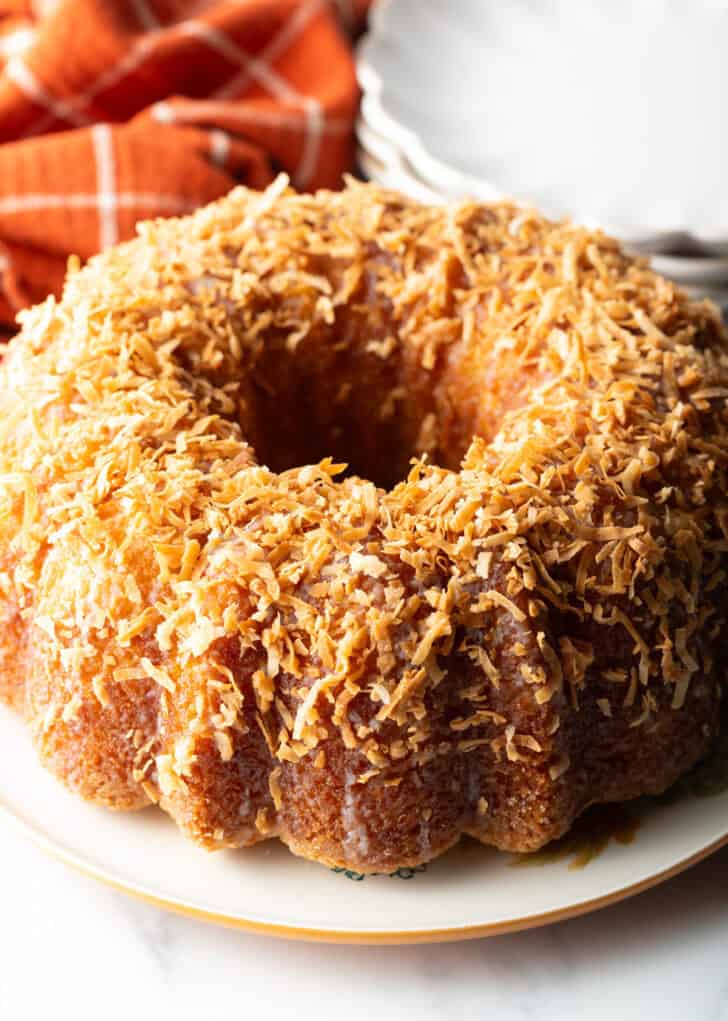 Rum soaked bundt cake covered in toasted coconut.
