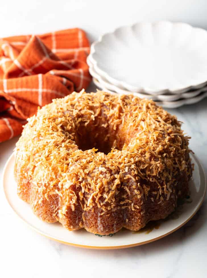 Rum soaked bundt cake covered in toasted coconut.