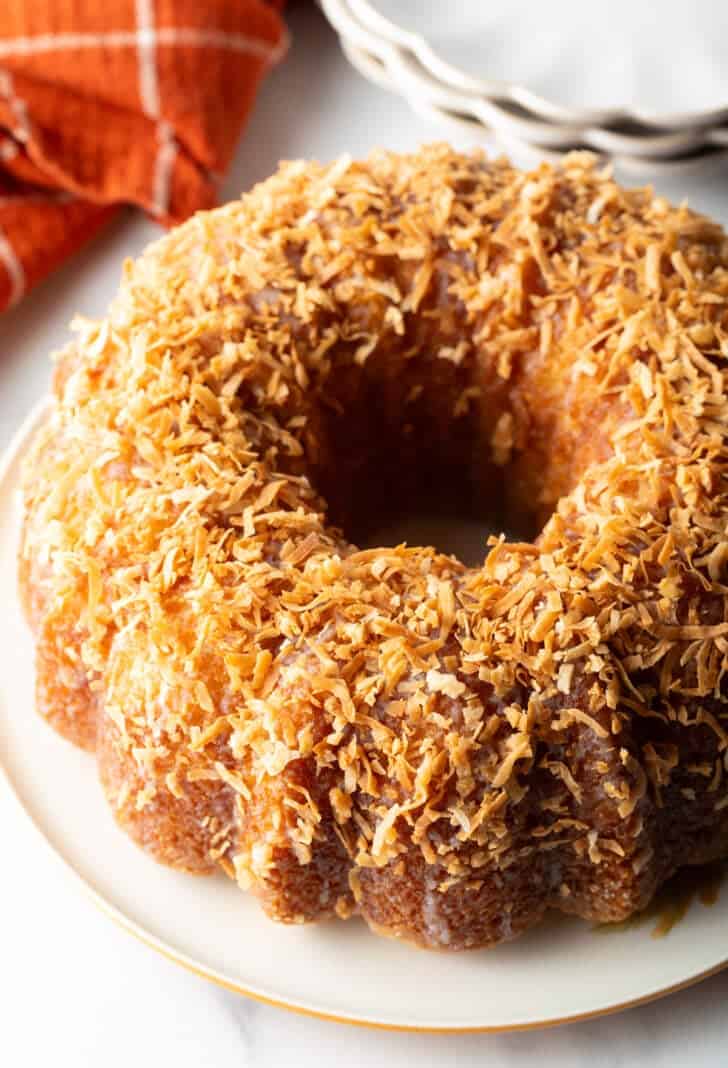 Rum soaked bundt cake covered in toasted coconut.